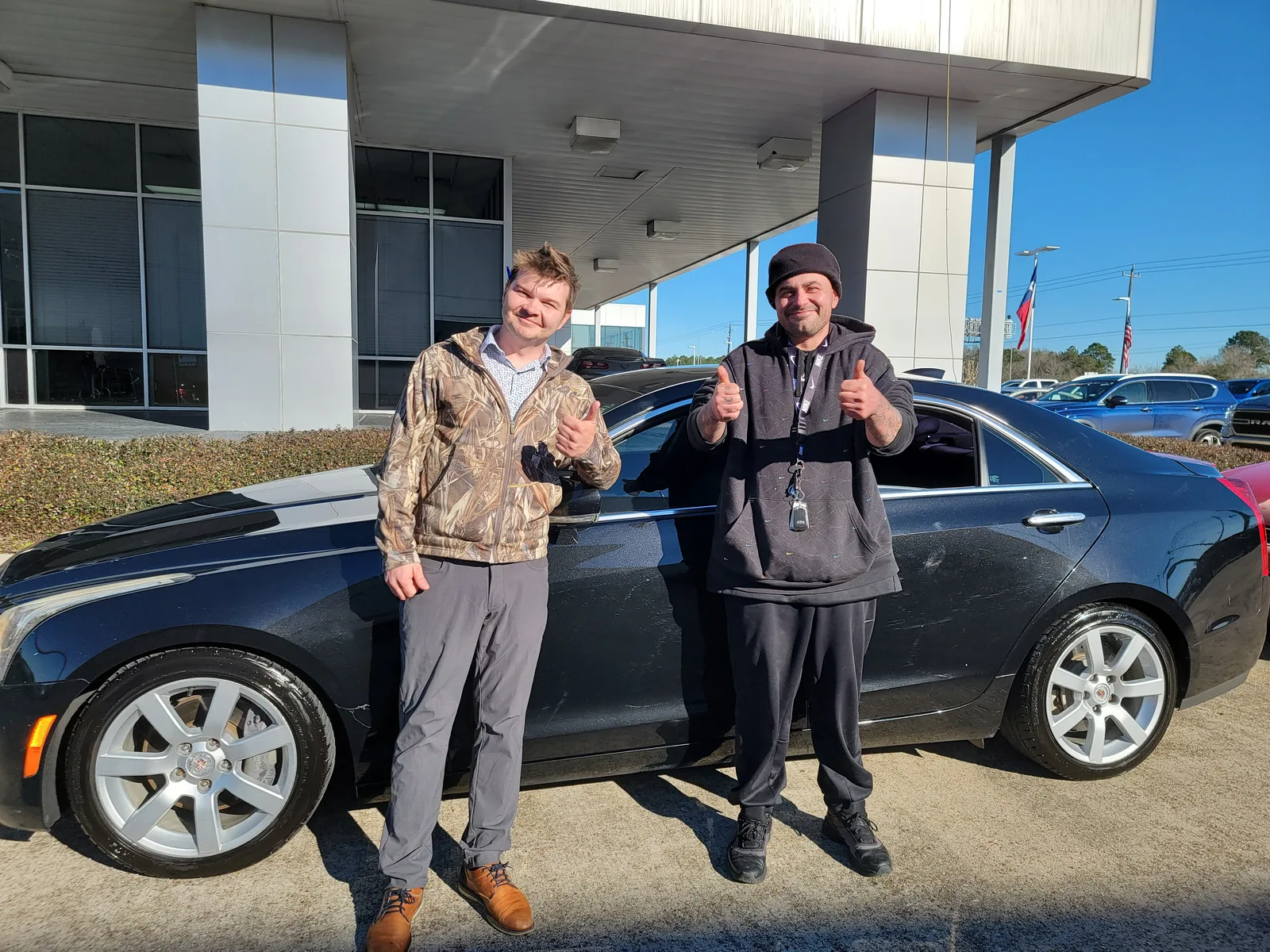Steven's customer taking delivery of a used sedan in East Texas